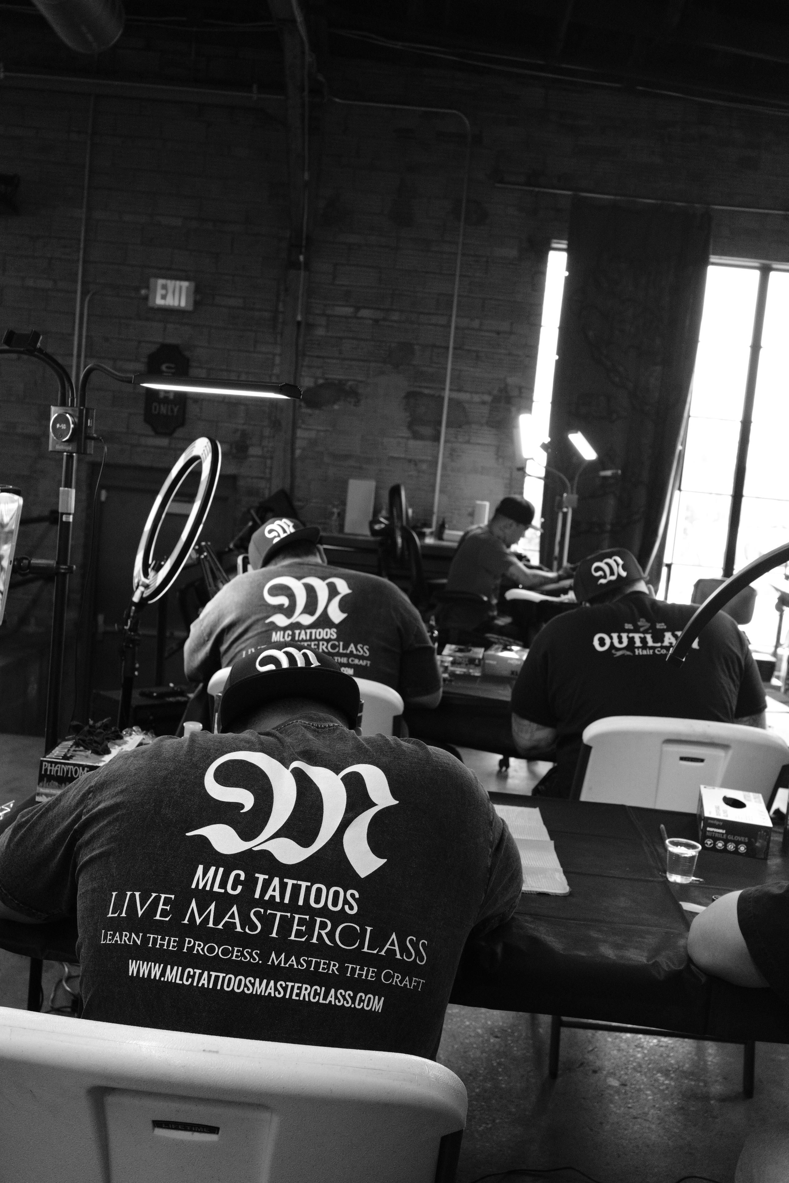 Mitchell Celaya teaching black and grey realism at an in-person seminar